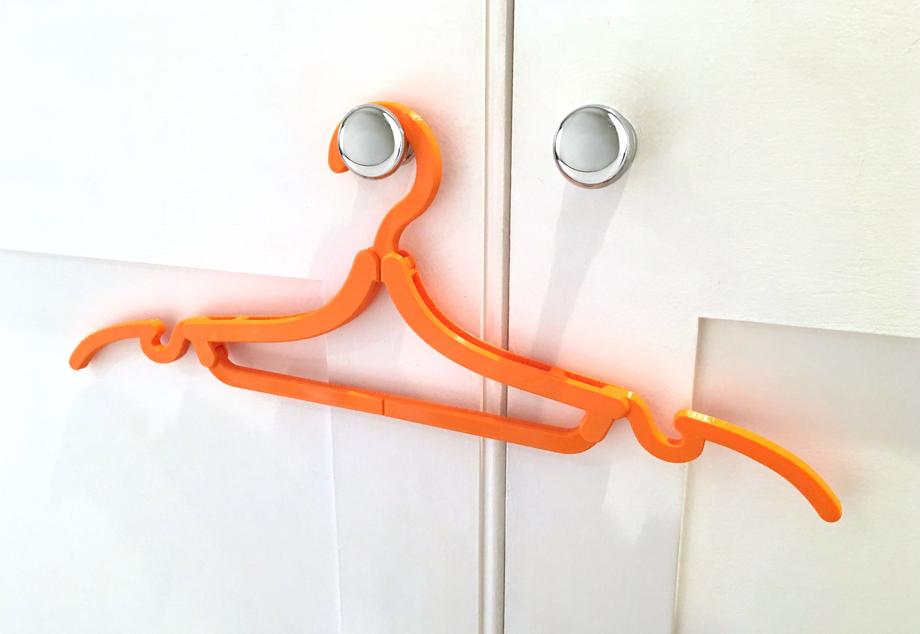 Folding travel coat hanger