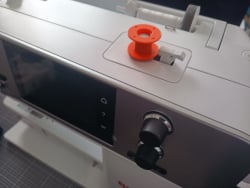 Sewing spool for bernina sewing machine and storage bin