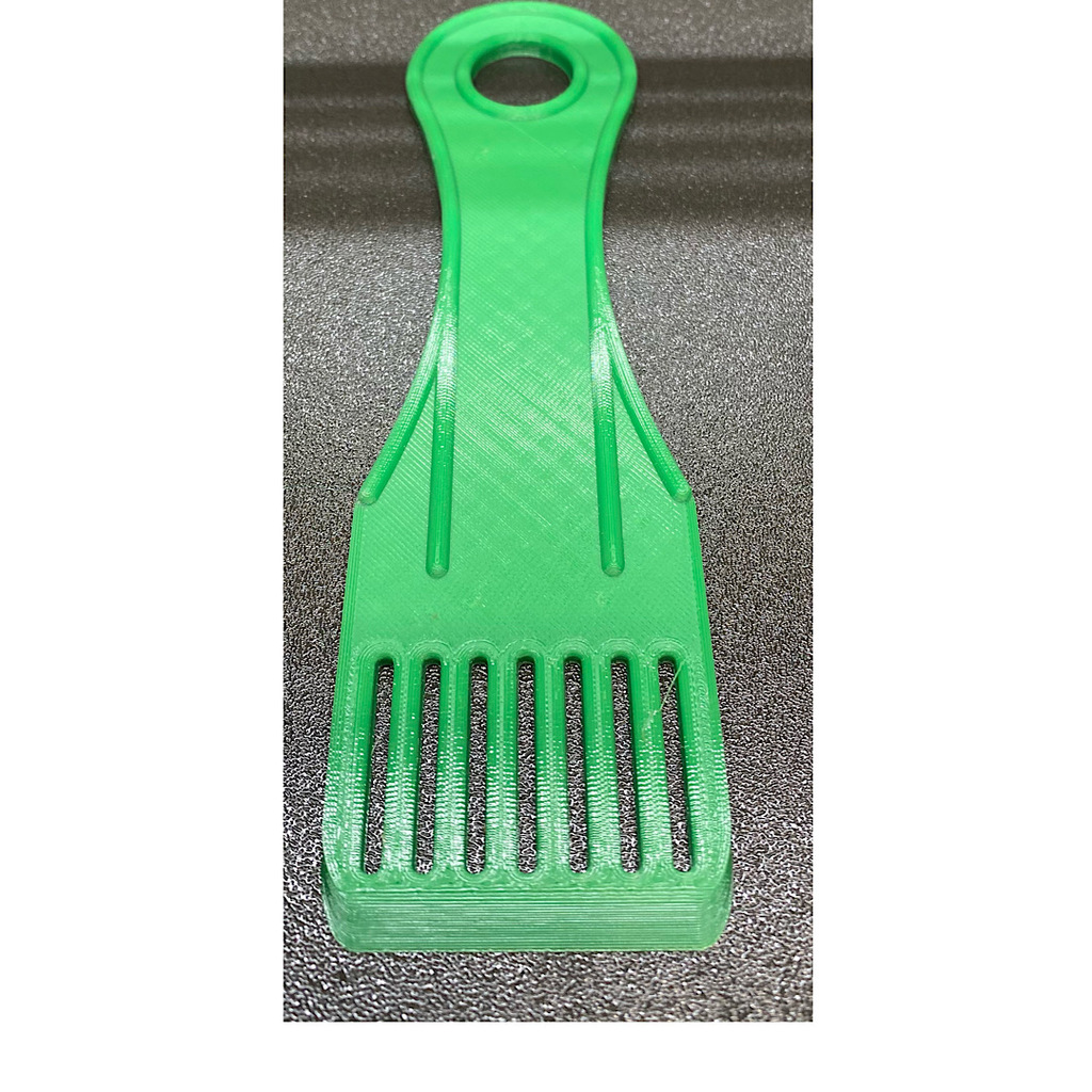Spatula with slots, rounded corners
