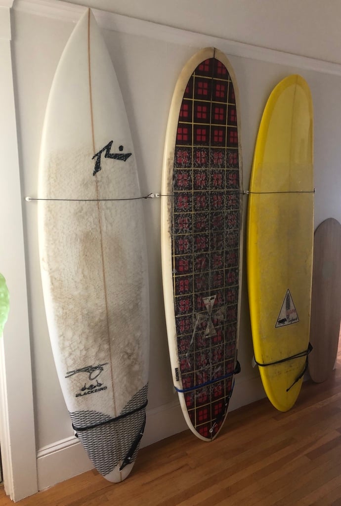 Surfboard wall rack