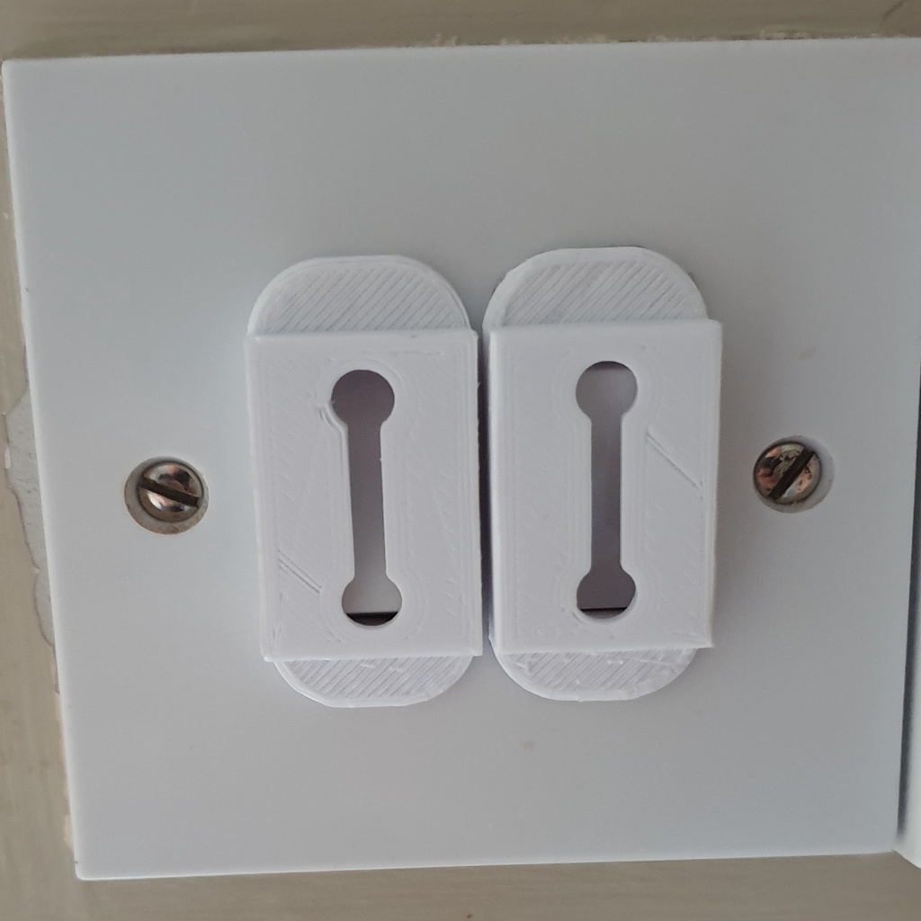 UK light switch lock covers