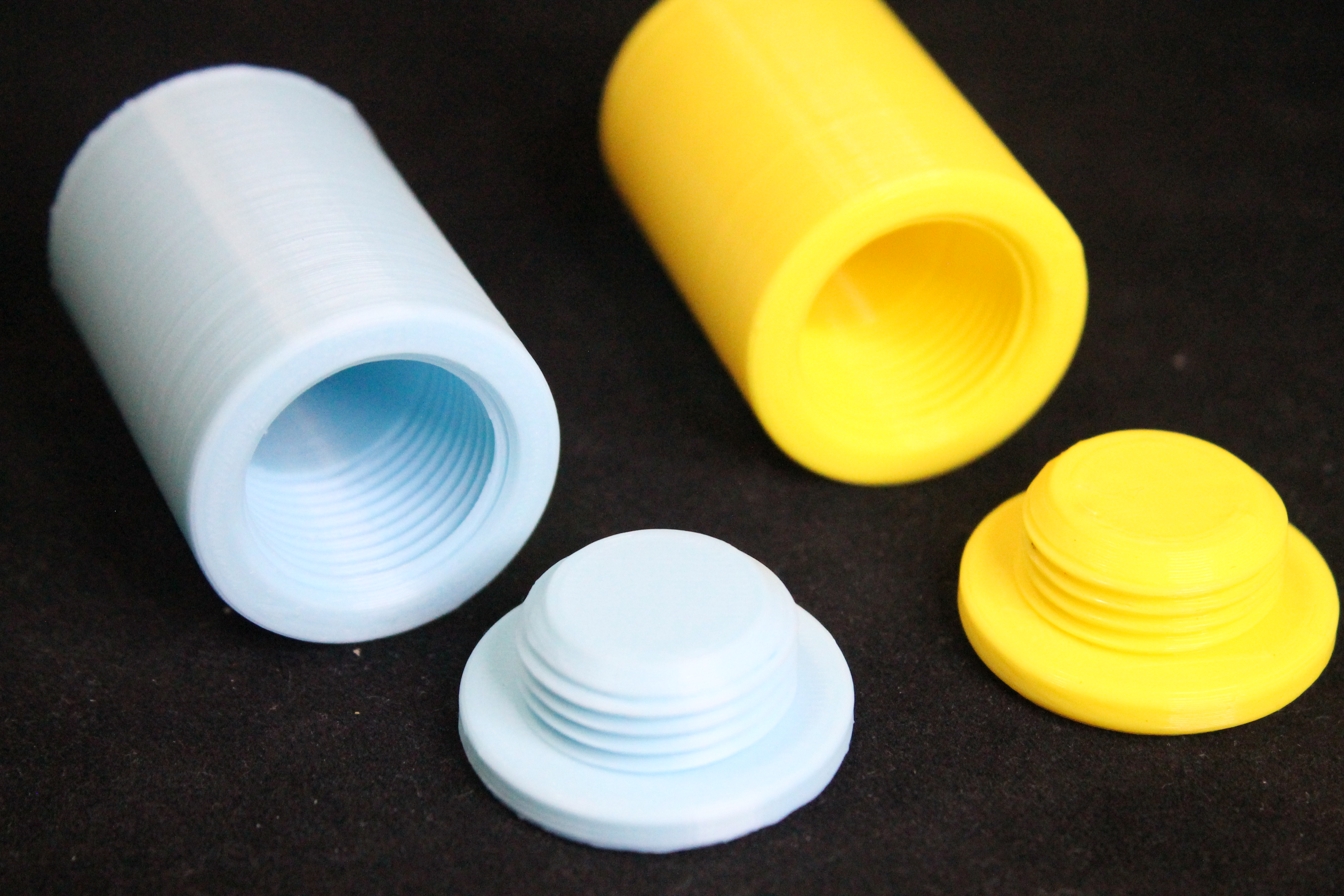 Cylindrical Container with threaded cap useful for carrying vitamins, etc