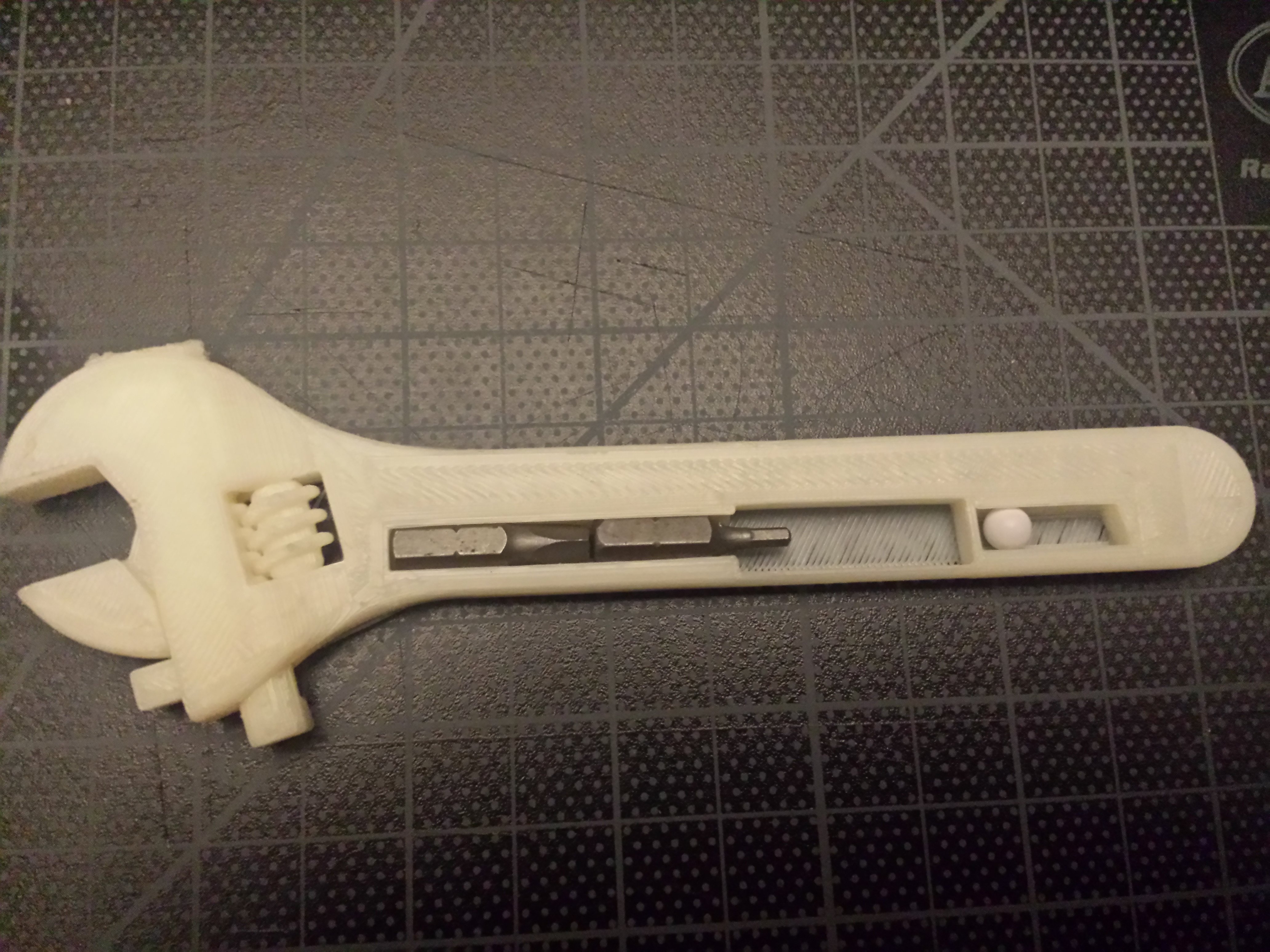 Fully assembled 3D printable wrench with level and bit storage.