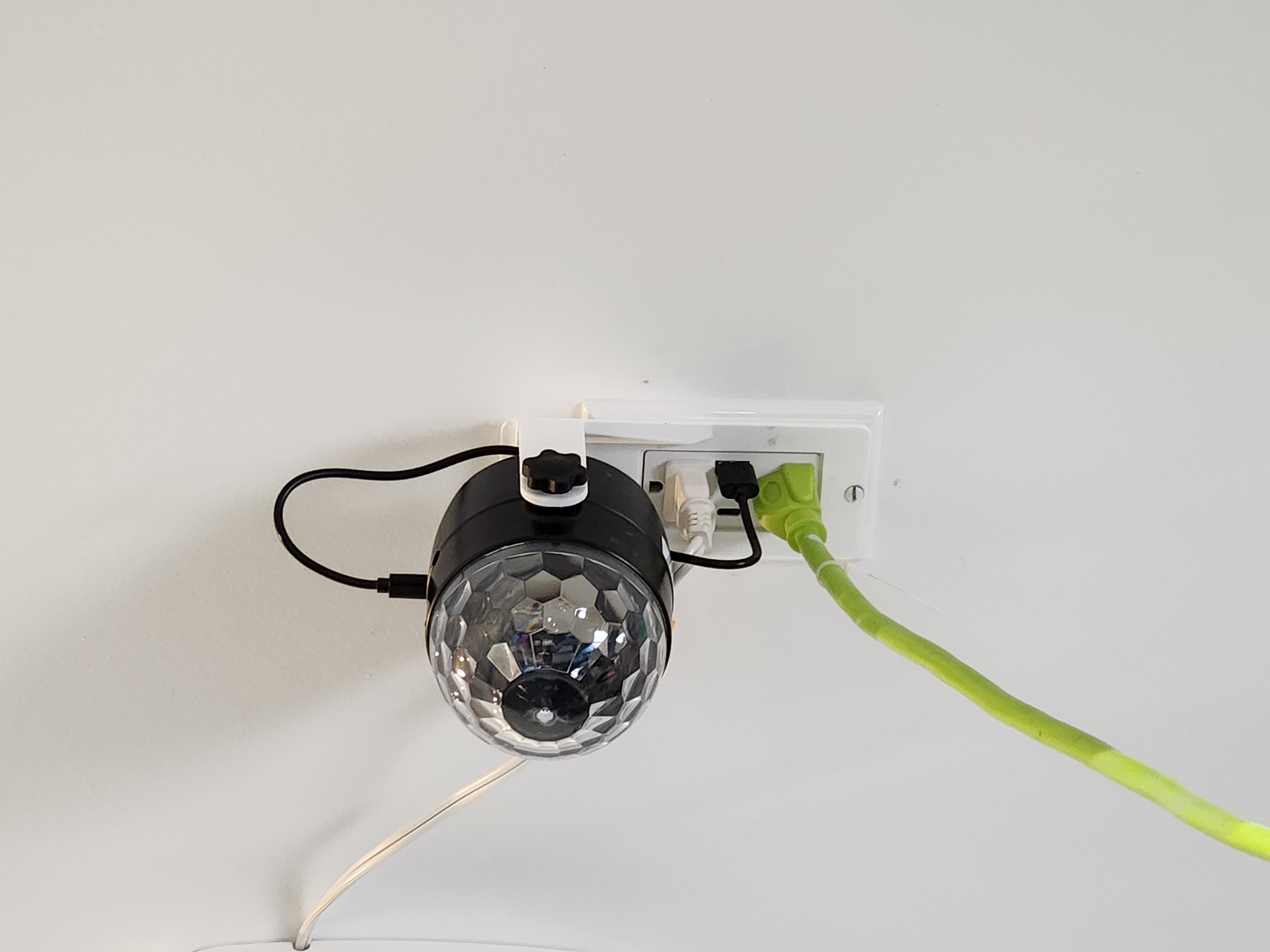 Disco ball mount for electrical outlet cover