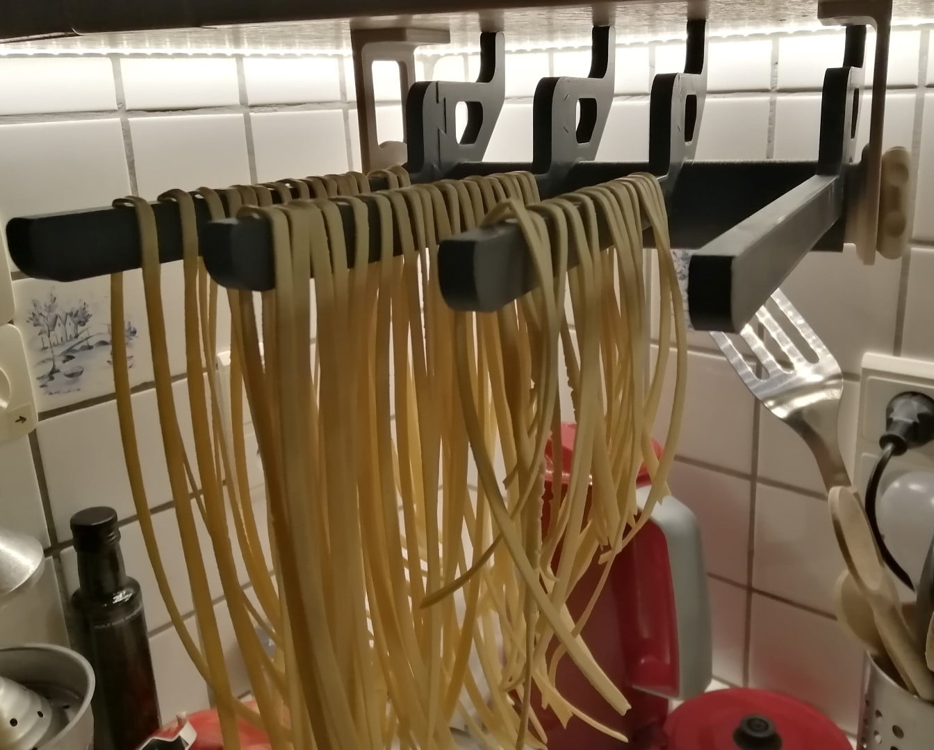 Pasta drying rack on paper towel dispenser