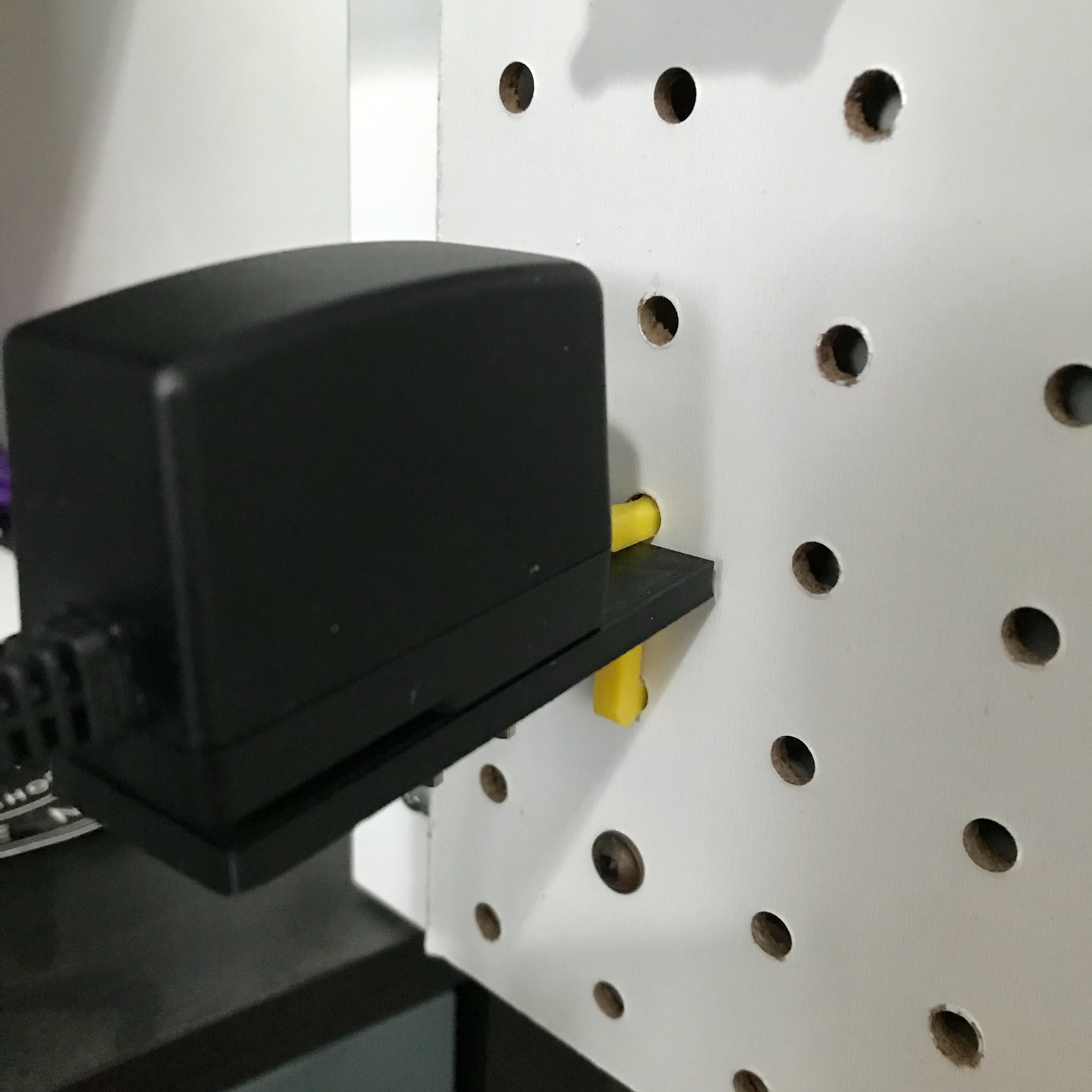 Parametric US power plug or adapter/charger holder for pegboards