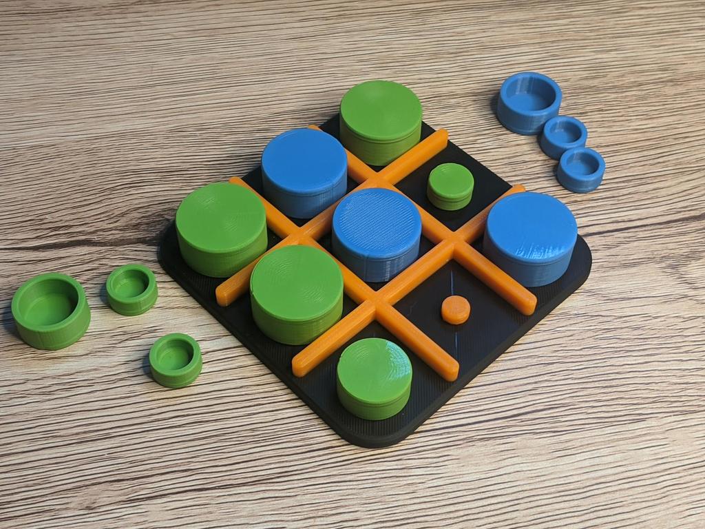Tic-Tac-Cap: A Game of Stacking and Stealing