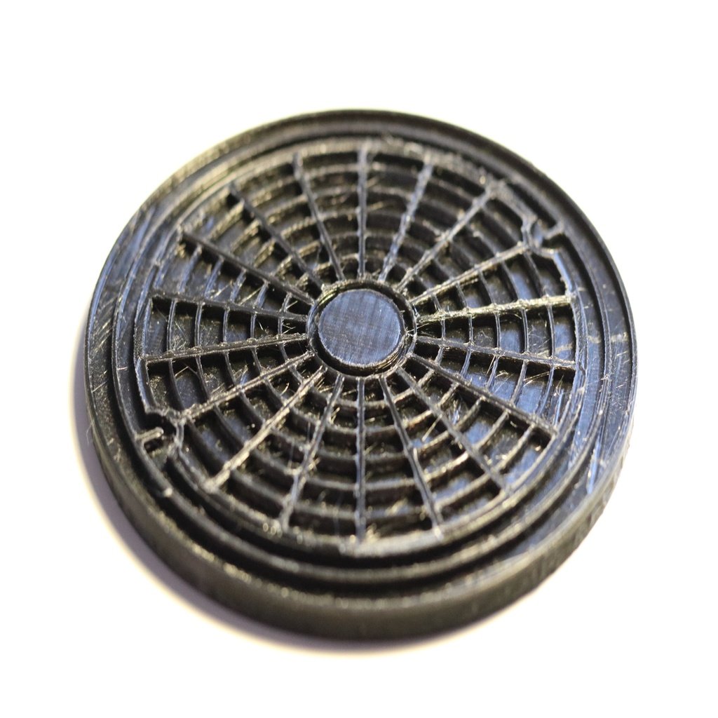 Coaster inspired by a manhole cover design