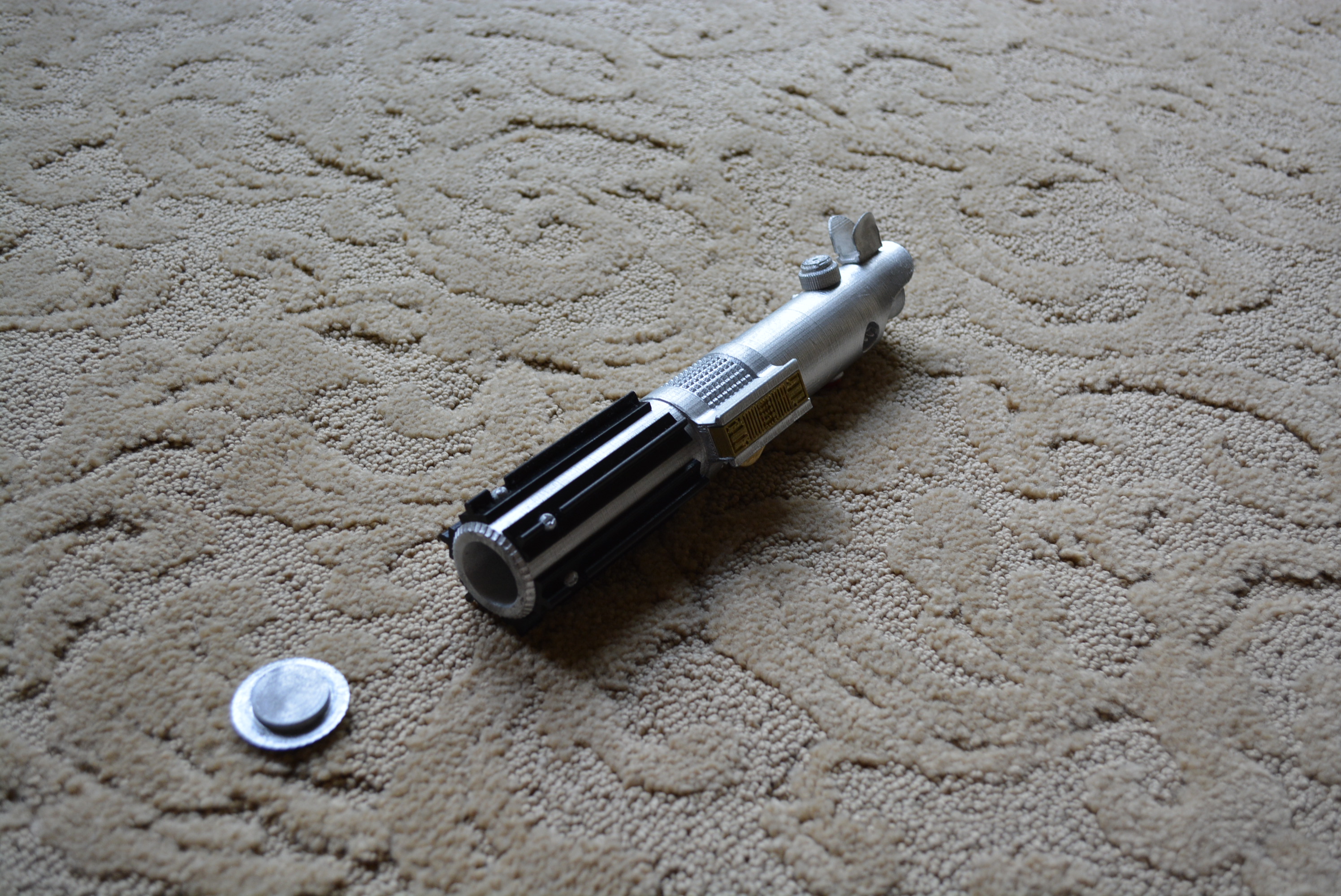 Lightsaber with hidden compartment