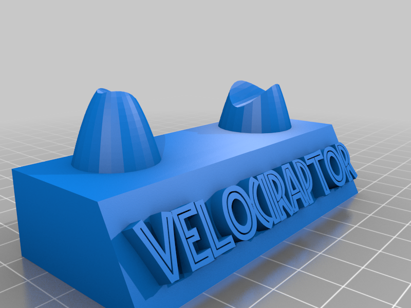 Velociraptor claw stand with label