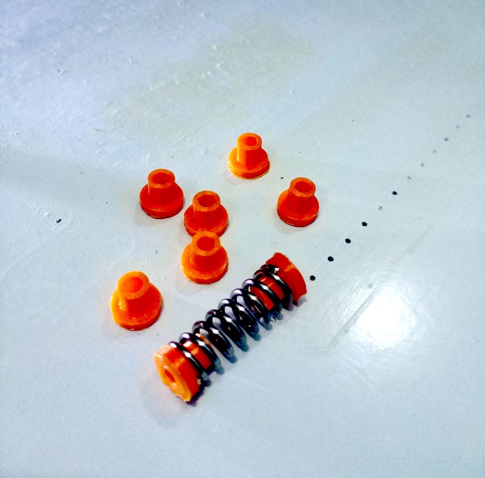 Hot bed leveling spring damper