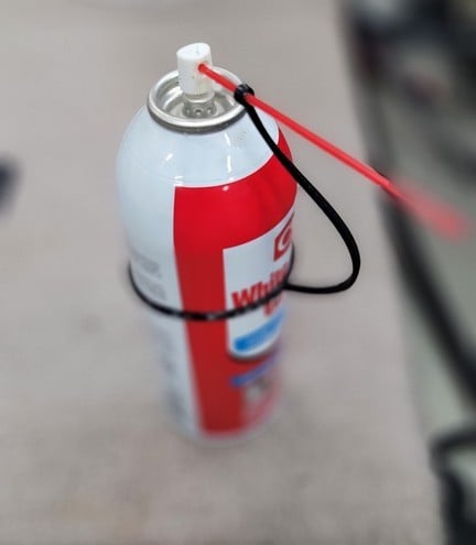 Spray can straw holder