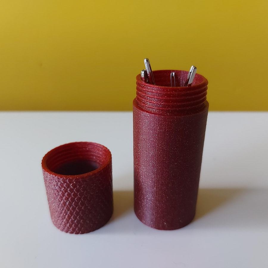 Small storage tube with screw-on cap