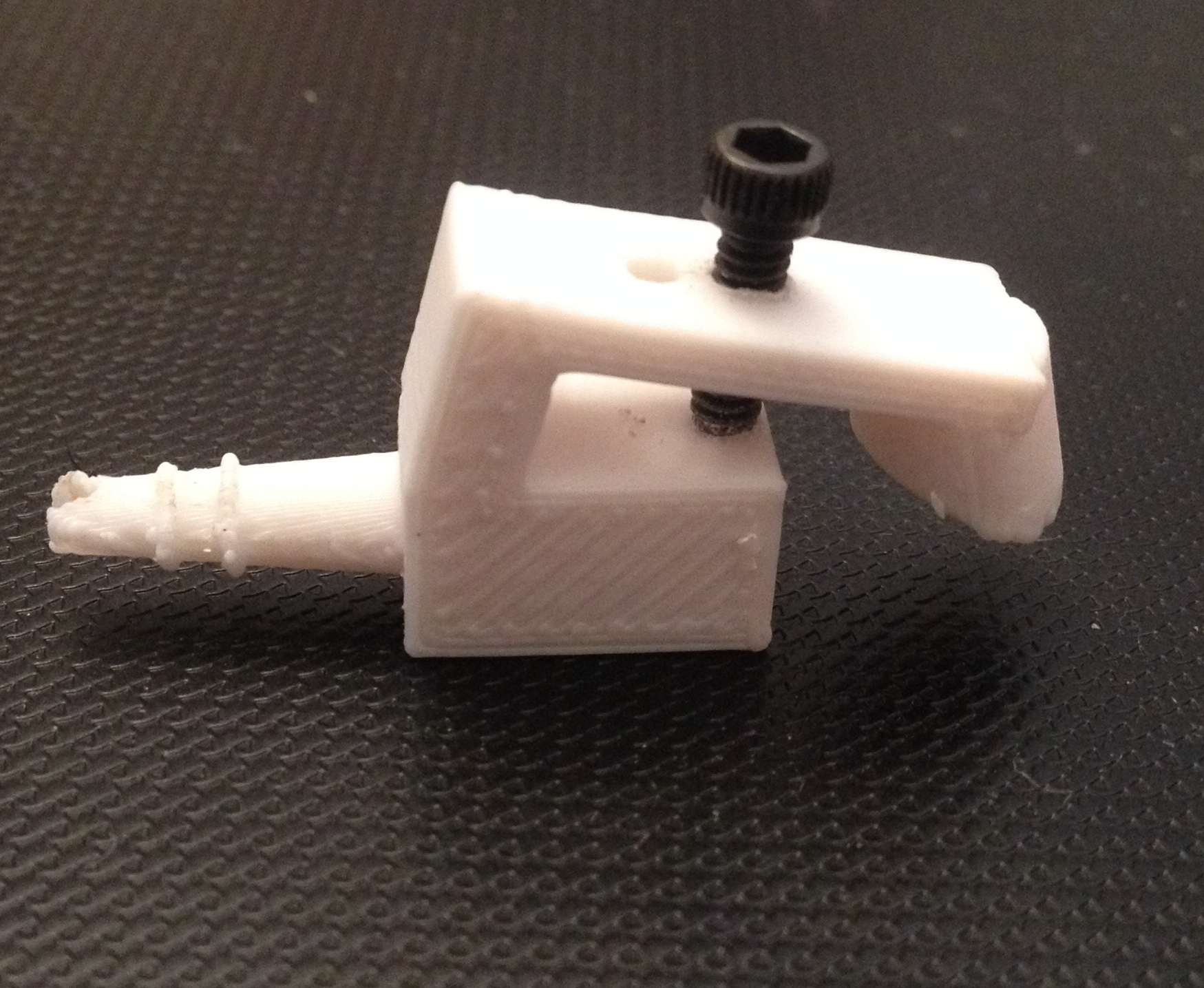 Adjustable sprinkler nozzle for drip irrigation tubing