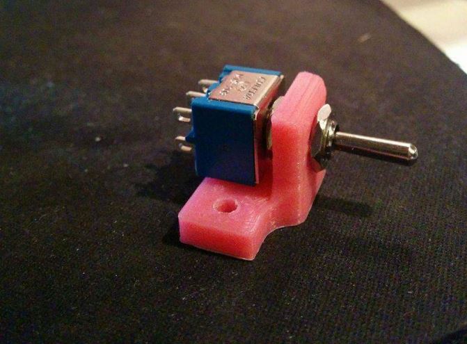 Angled switch holder