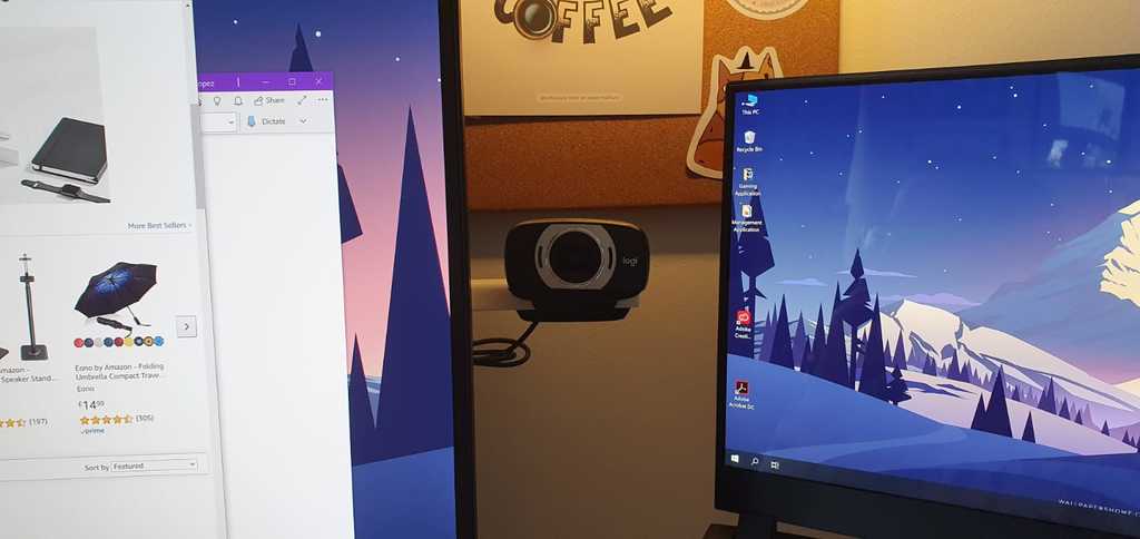 Hideable webcam mount behind monitor