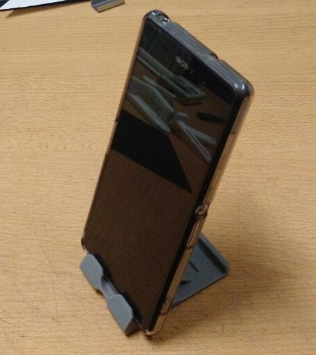 Foldable dock/stand for smartphones and small tablets.