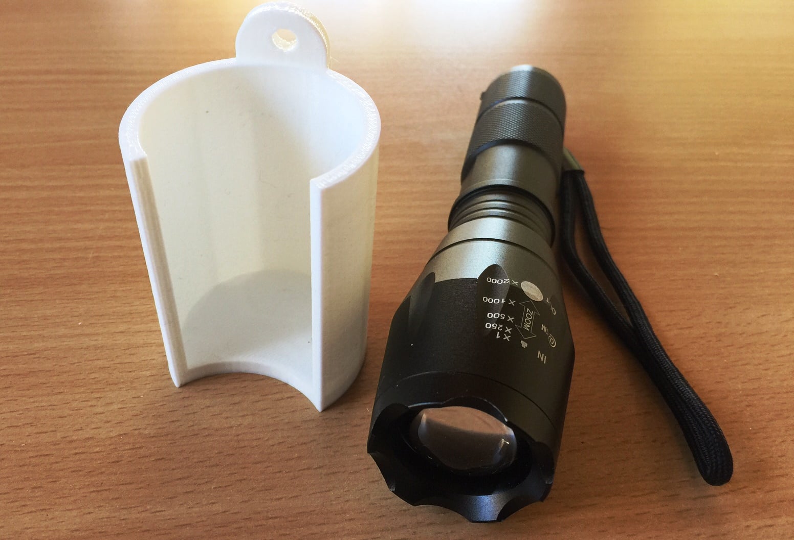 Wallmount holder for flashlight