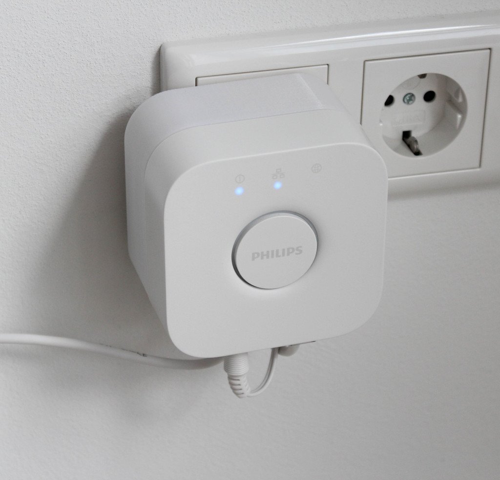 Socket mount with cable management for Philips Hue Bridge