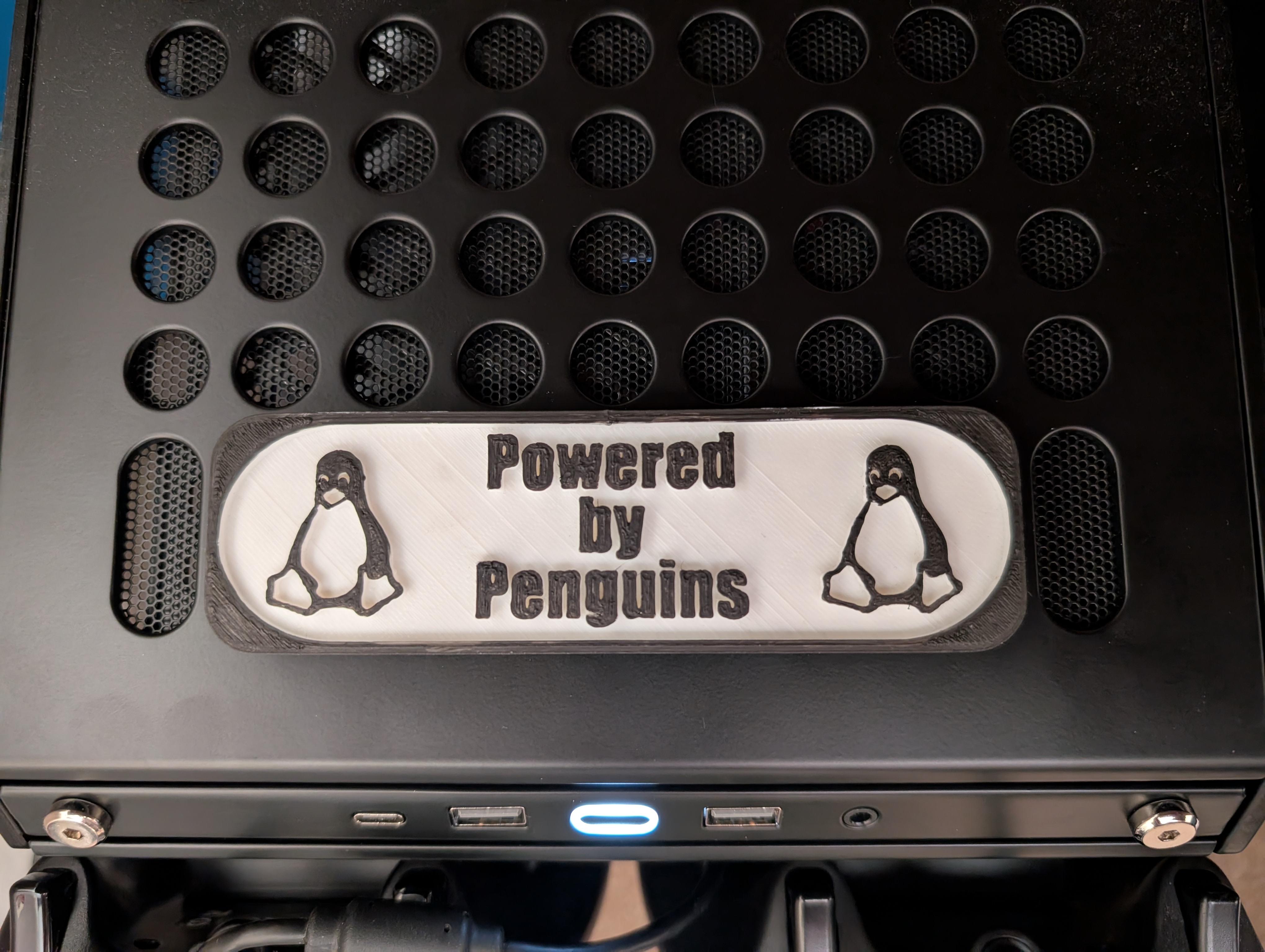 Qube 500 Powered By Penguins Sign