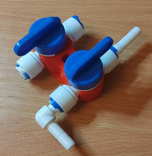 Holder of quick disconnect fittings and plastic valves for water cooling of the 3D printer.