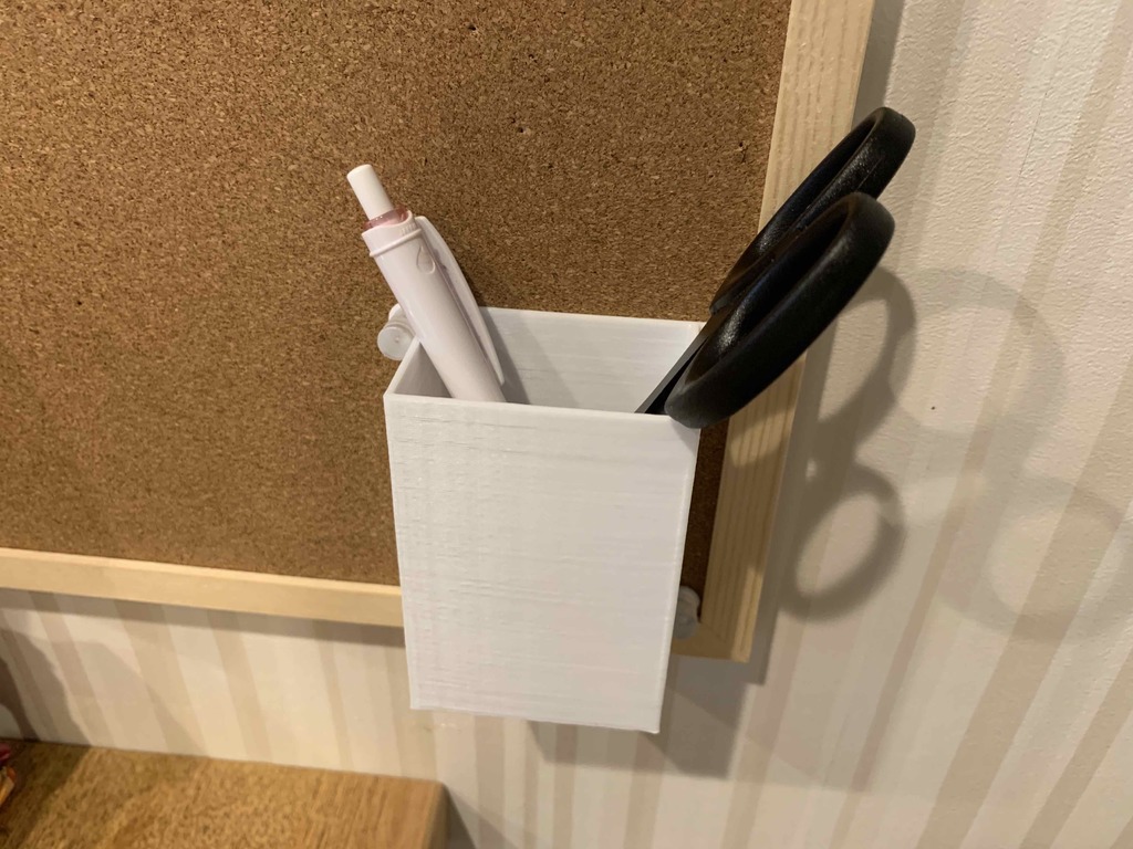 Wall mounted pen holder