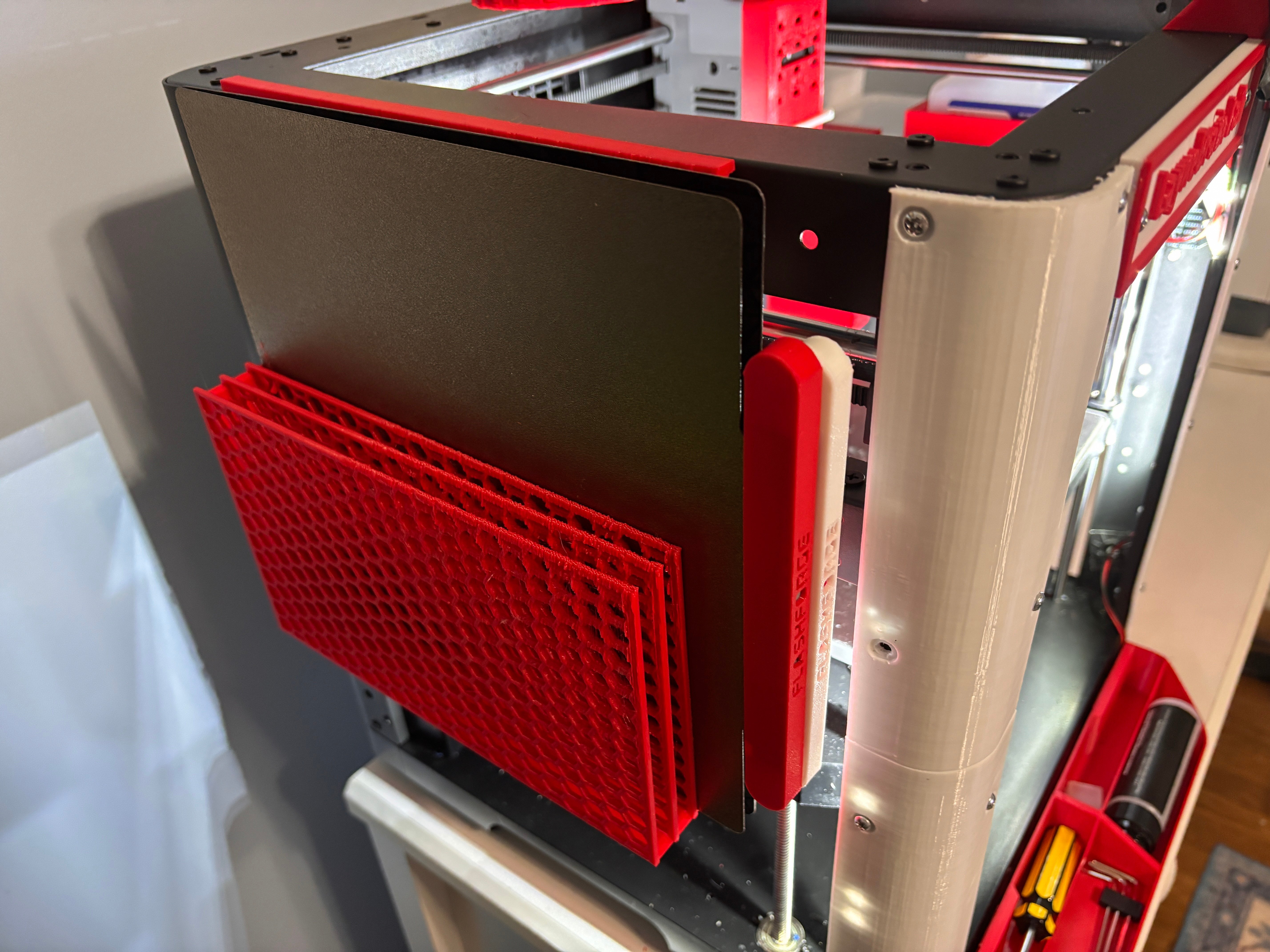 Side-mounted honeycomb build plate storage for FlashForge AD5M