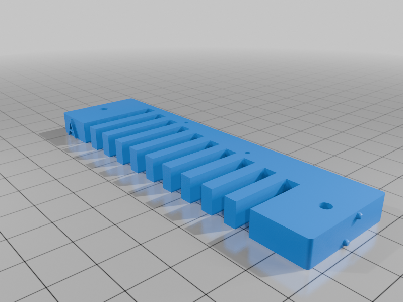 HARMONICA COMB WITH BRAILLE MARKINGS