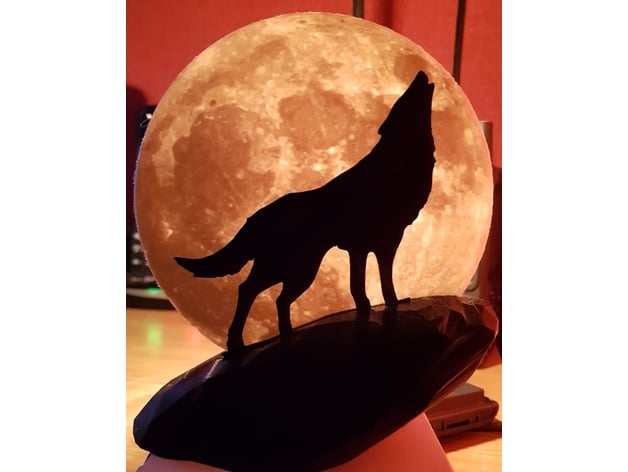 Wolf howling at the moon