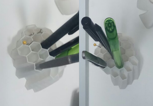 Honeycomb wall mounted pen holder