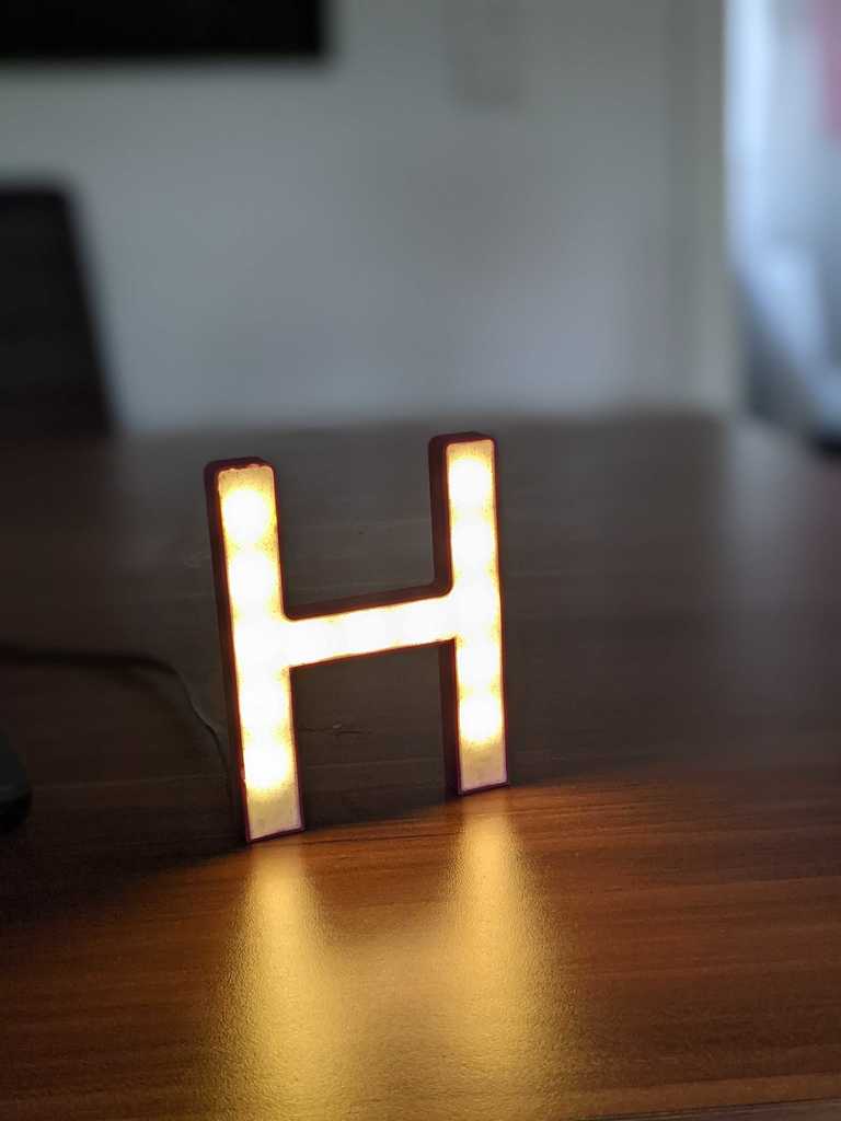 Glowing letter H