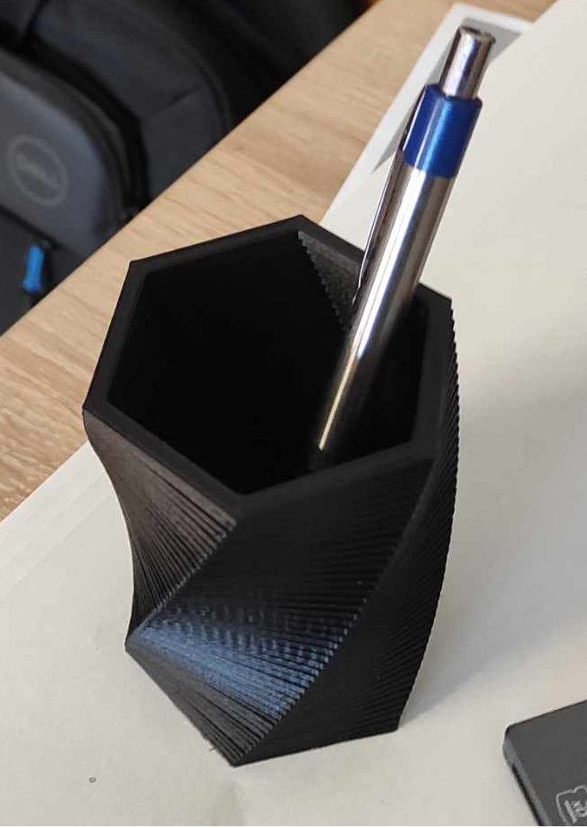 Twisted pencil and pen holder