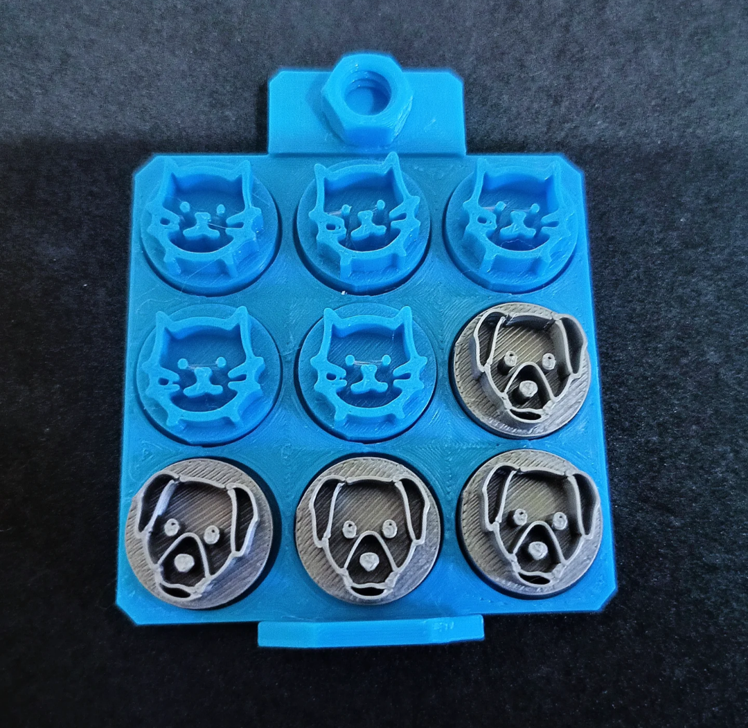 A set for the tic tac toe game, with pieces in shapes of cats and dogs