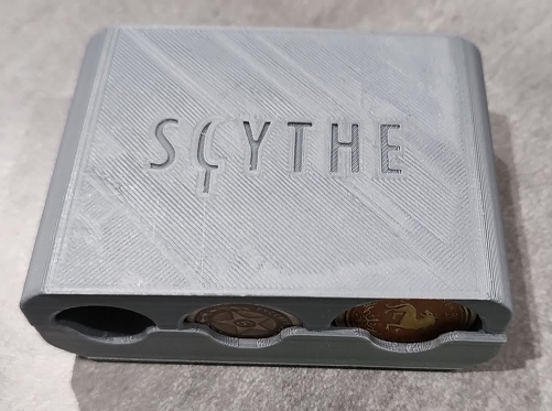Scythe coin box