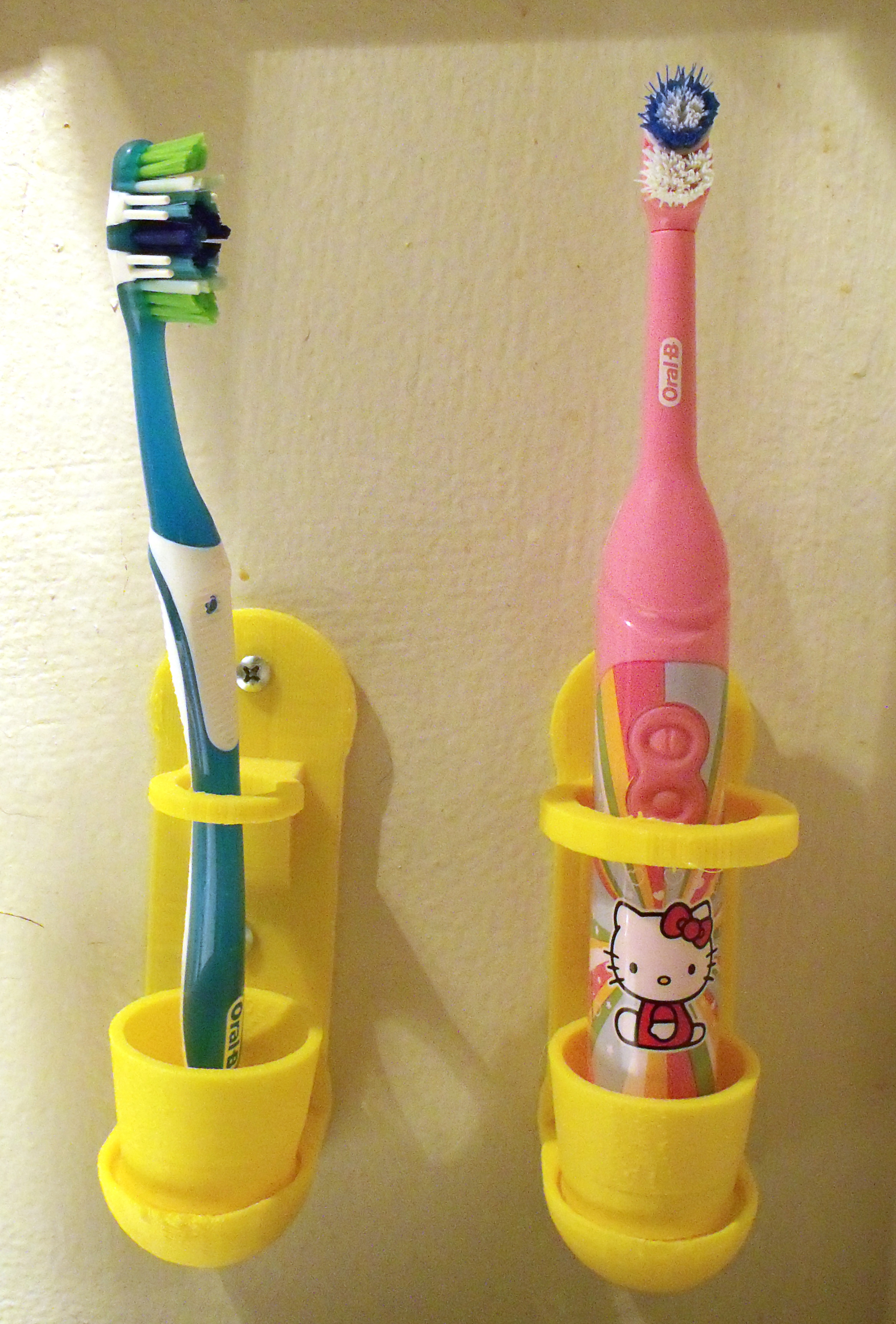 Wall mounted toothbrush holder with removable cup