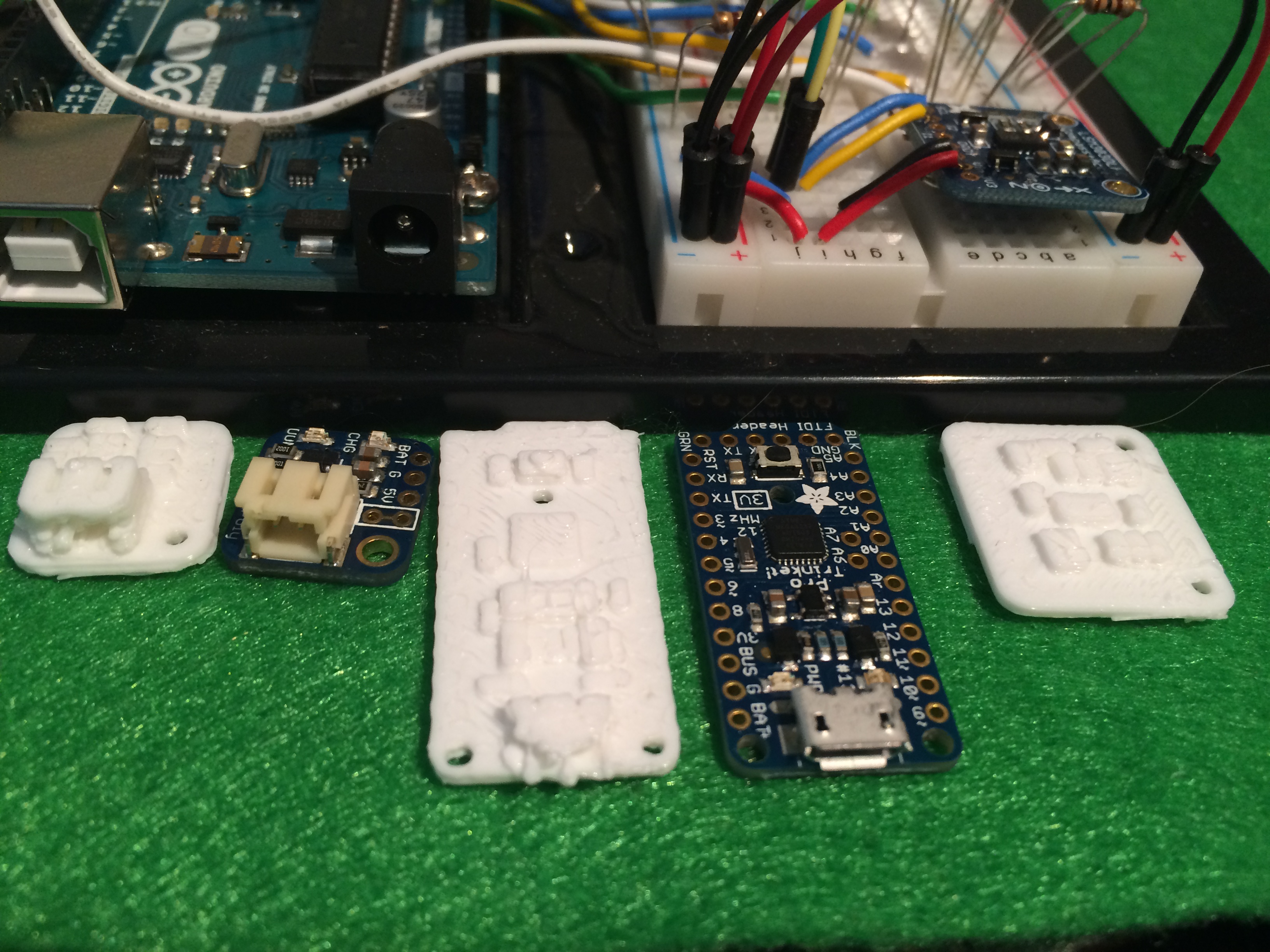Adafruit boards: ProTrinket, ProTrinket backpack for Lilon batteries, and Compass/accel module