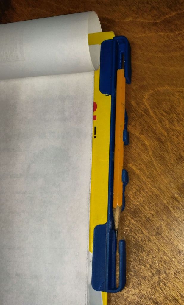 Pencil mount for paper tablet
