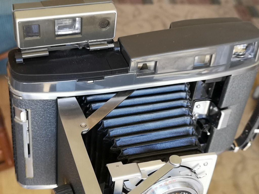 Polaroid roll film camera viewfinder mount 