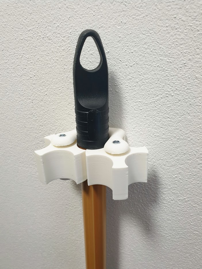 Odd broom hanger