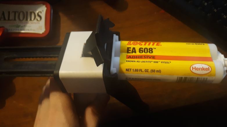 Epoxy gun faceplates for different cartridge sizes
