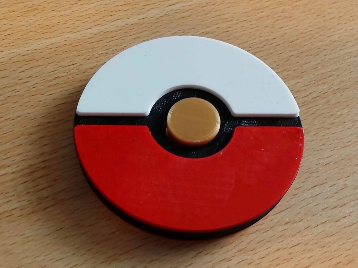 Poké ball fidget spinner