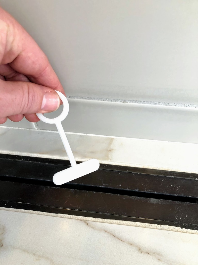 Linear shower drain removal tool