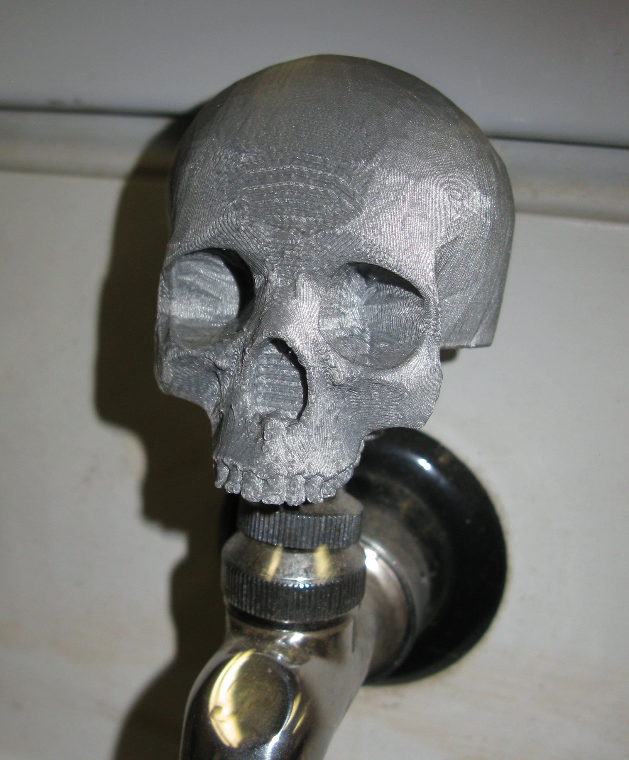 Skull tap handle