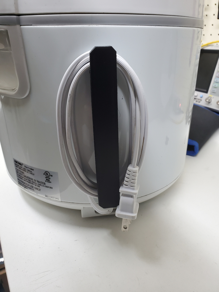 Rice cooker power cable cleat