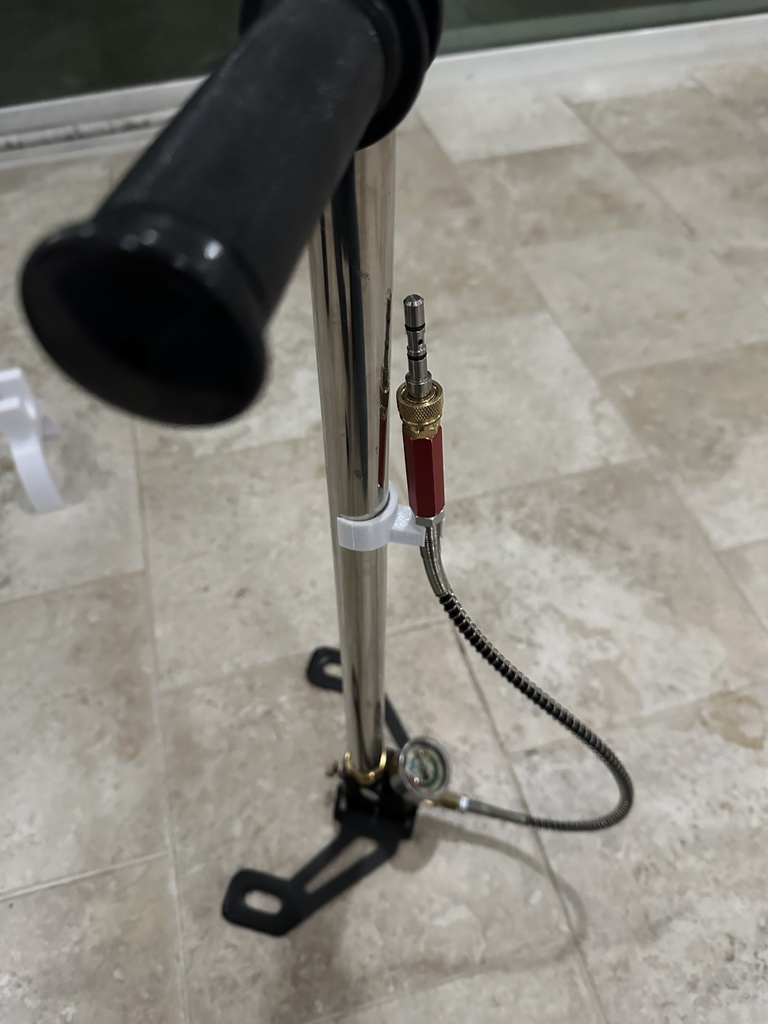 Filling probe hanger for high pressure hand pump