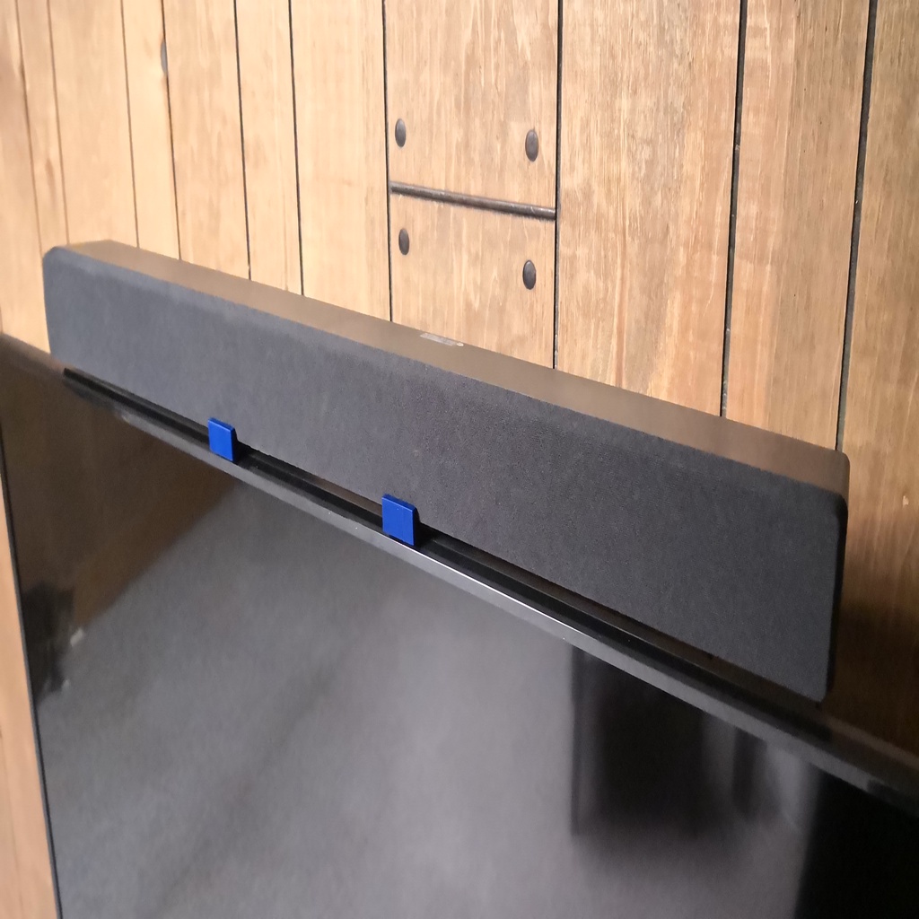 Soundbar mount for TV wallmount bracket holes.