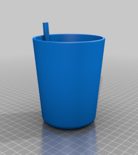 cup with a straw embedded 