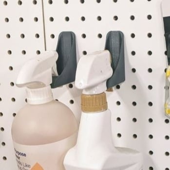 Spray bottle holder for pegboard