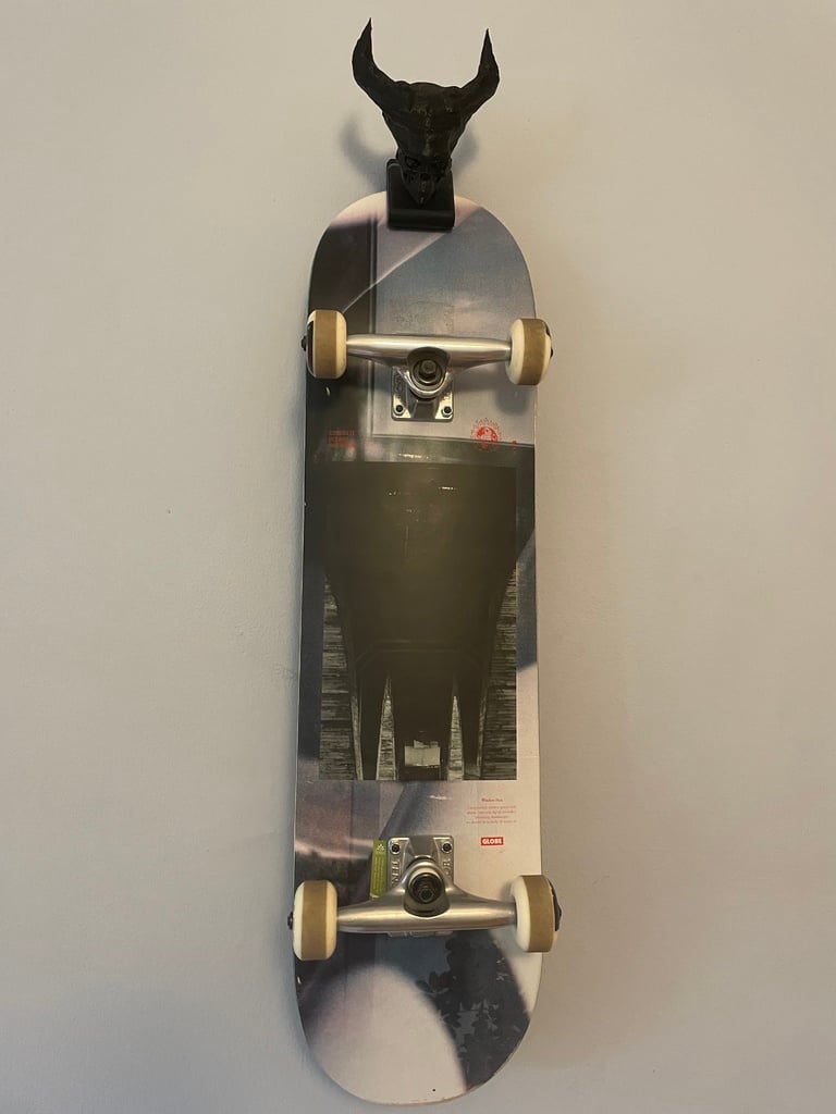 Skateboard wall holder