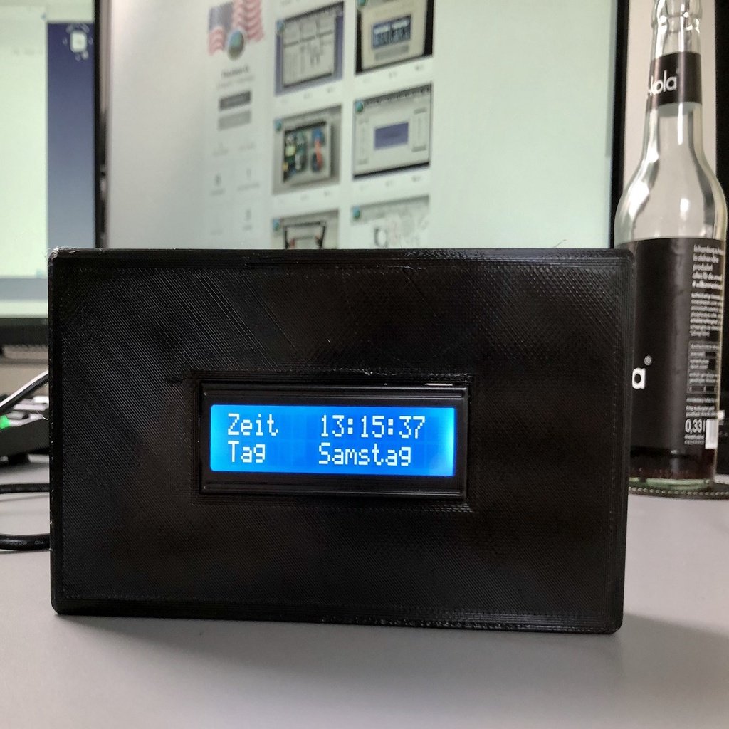 Arduino digital clock case with time, day, date and temperature